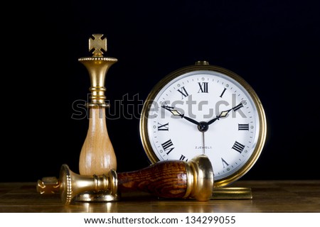 Some Chessmen with a Old Watch