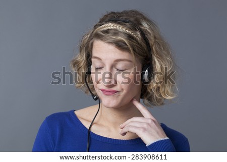 tired young call center assistant resigned by difficult phone calls on her headset