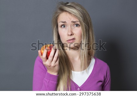 Similar – Foto Bild Skeptisches Mädchen isst Obst im Garten