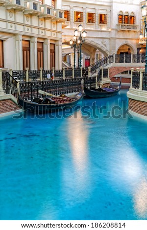 Las Vegas, NV, USA - April 7th, 2013: Indoor view of the canals inside the Venetian Casino. Canal blue water in the foreground with Buildings gondola and bridges in the background. No people.