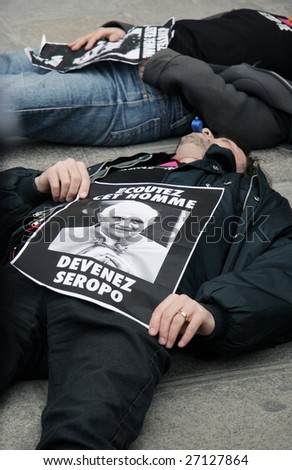 PARIS - MARCH 22: Members of the Act Up organisation lay down by Notre-Dame Cathedral to protest against Pope Benedict XVI\'s remarks on condoms and abortion on March 22, 2009 in Paris, France.