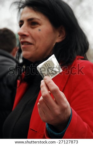 PARIS - MARCH 22: Members of the Act Up organisation give out condoms by Notre-Dame Cathedral to protest against Pope Benedict XVI\'s remarks on condoms and abortion on March 22, 2009 in Paris, France.