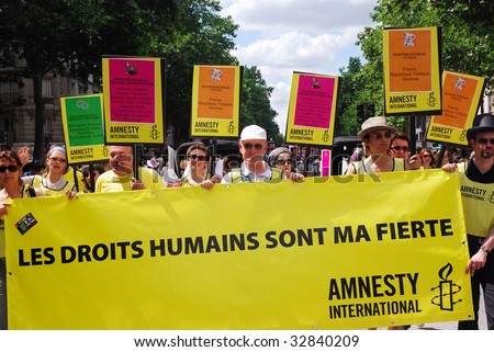 PARIS - JUNE 27: Members of Amnesty International participate in the Paris Gay Pride parade to support gay rights June 27, 2009 in Paris, France.