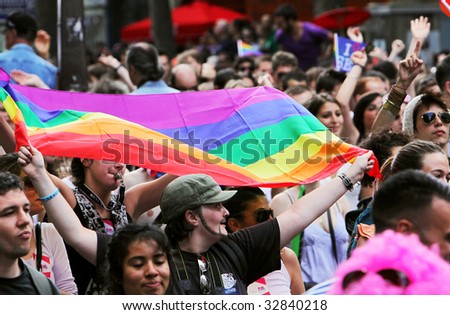PARIS - JUNE 27: People take part in the Paris Gay Pride parade to support gay rights  June 27, 2009 in Paris, France.