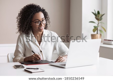 Similar – Image, Stock Photo Woman using her laptop at home.