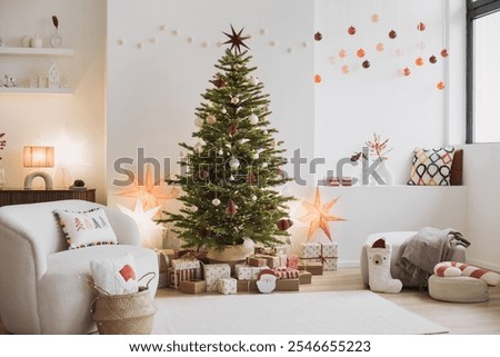 Similar – Image, Stock Photo Comfort, home and Christmas Eve concept. Bedroom with white soft bed, mirror, big window for light coming in room, decorated New Year tree and ladder. Holiday decoration.