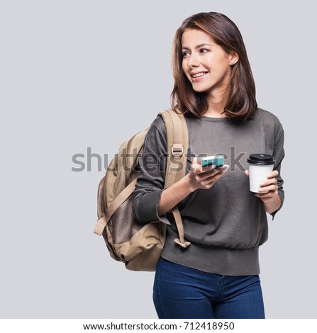 Similar – Foto Bild Student mit Rucksack beim Tippen auf Laptop und Notizblock im Park an hellem Tag