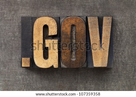 dot gov - internet domain for government  in vintage wooden letterpress printing blocks on a grunge metal sheet