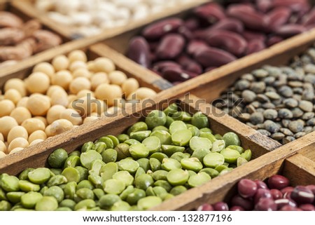 legumes in box abstract with a selective focus on green pea, shallow depth of field