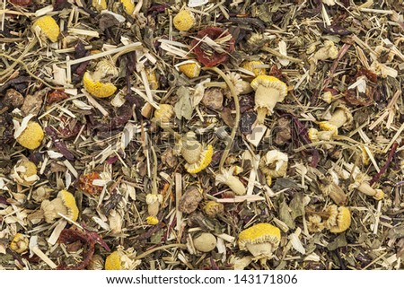 background of organic herbal tea - chamomile, peppermint,,orange peel, rose hips, hibiscus,