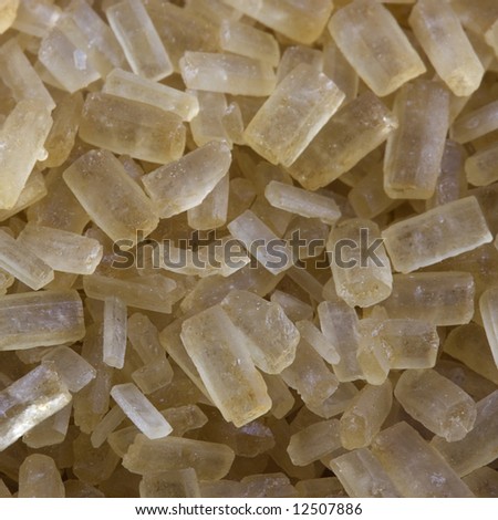 amber colored crystal of natural cane sugar from Maui, Hawaii - background