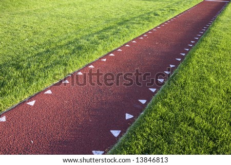 running track with a red synthetic surface for a long jump competition