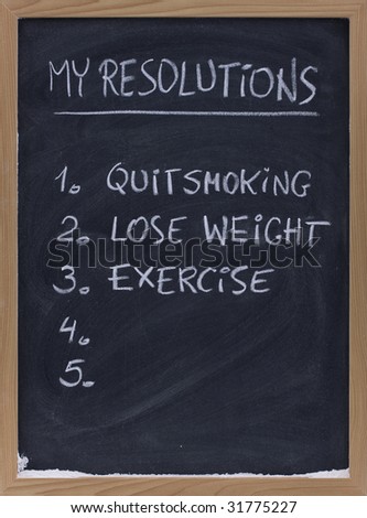 numbered resolution lists (quit smoking, exercise, loose weight, ...) - handwriting with white chalk on small blackboard, copy space