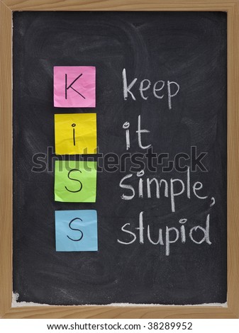KISS keep it simple, stupid - design principle presented with sticky notes and white chalk handwriting on blackboard