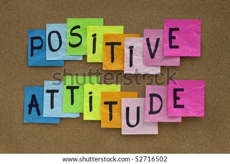 positive attitude concept - colorful sticky notes reminder on cork bulletin board