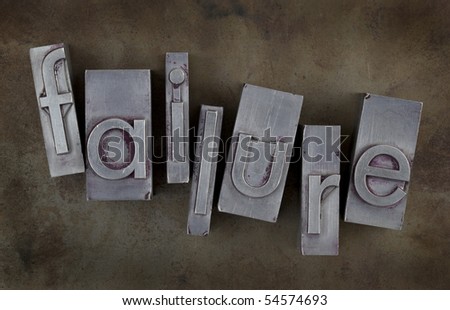 the word of failure in old metal letterpress type blocks on rusty and grunge background
