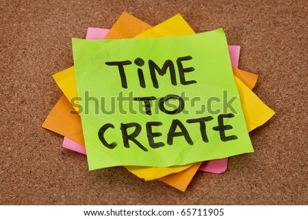 creativity concept - time to create reminder on a stack of sticky notes against cork bulletin board