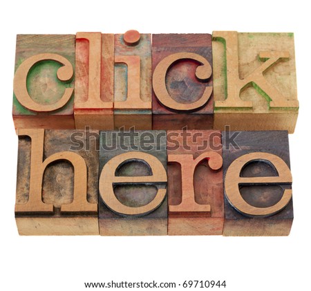 internet concept - click here words in vintage wooden letterpress printing blocks, stained by color inks, isolated on white