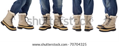man legs in blue jeans and heavy snow boots, four poses isolated on white