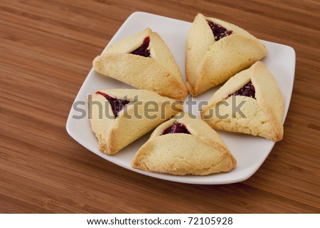 raspberry hamantaschen cookies - a traditional pastry in Ashkenazi Jewish cuisine for holiday of Purim