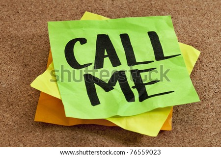 call me on sticky note posted on a cork board