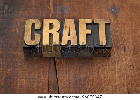 craft word in vintage letterpress wood type against grunge weathered wooden background