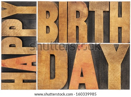 happy birthday - isolated text abstract - letterpress wood type printing blocks scaled to a rectangle