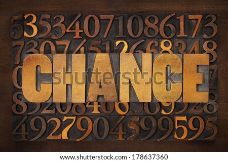 chance word in letterpress wood type against data numbers background - opportunity and risk concept