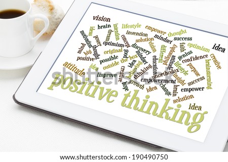 positive thinking and attitude word cloud on a white digital tablet with a cup of coffee