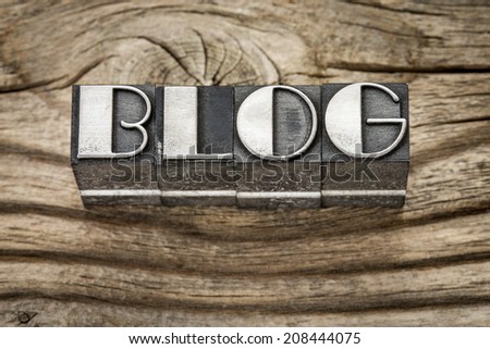 blog word in letterpress metal type printing blocks against weathered grained wood