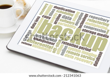 backup word cloud on a digital tablet with a cuo of coffee