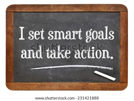 I set smart goals and take action - positive affirmation words on a vintage slate blackboard
