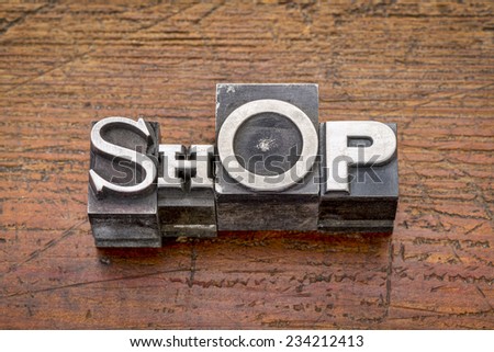 shop word in mixed vintage metal type printing blocks over grunge wood