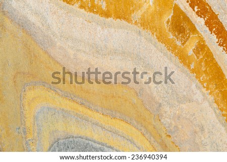 flat, orange, yellow and blue slate stone with abstract wave pattern