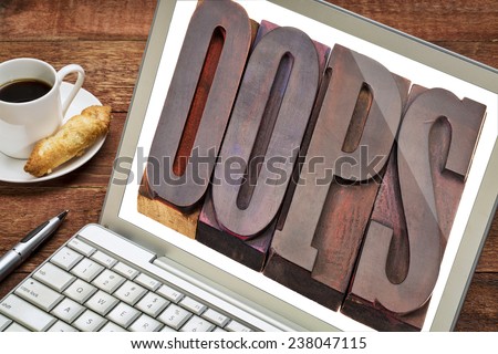 internet concept - oops exclamation word in vintage wooden letterpress printing blocks on laptop screen