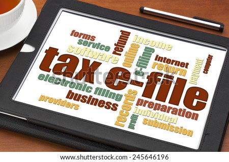 tax electronic filing concept - a word cloud on a digital tablet with a cup of tea