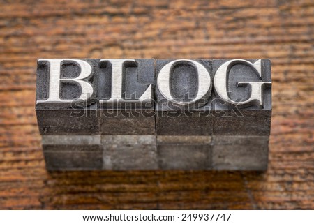 blog word in mixed vintage metal type printing blocks over grunge wood