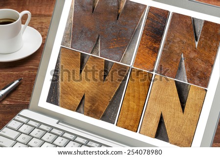 win-win - negotiation or conflict resolution strategy  -  words in letterpress wood type on a laptop screen with a cup of coffee