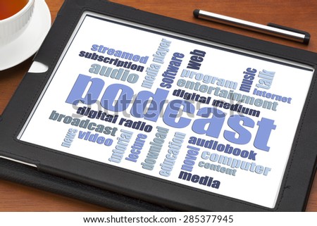 podcast word cloud on a digital tablet with a cup of coffee - internet radio concept