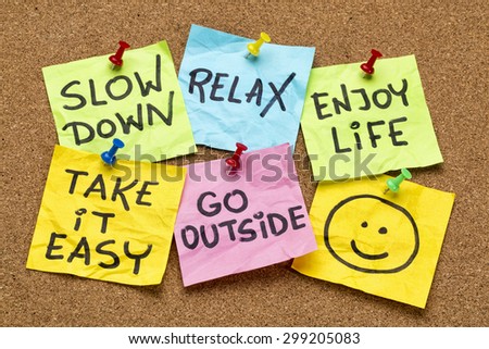 slow down, relax, take it easy, enjoy life -  motivational lifestyle reminders on colorful sticky notes