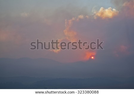 heavy smoke from High Park wildfire obscuring the sun and sky over Rocky Mountains near Fort Collins, Colorado,  June 10, 2012