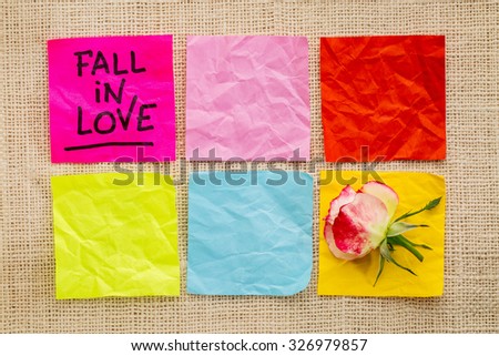 fall in love advice or  reminder on sticky notes with a rose flower