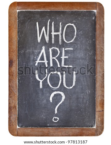 who are you question - white chalk handwriting on vintage slate blackboard, isolated on white
