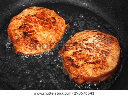 Steaks are fried in a skillet