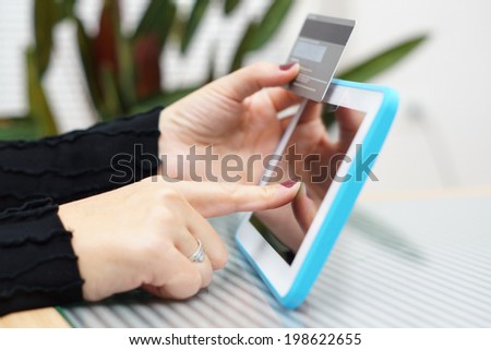 Woman holding tablet pc and credit card , Internet Shopping Concept