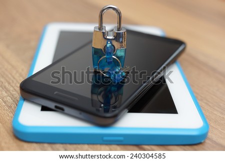 Padlock on smart phone and tablet computer. Safety & security on web devices