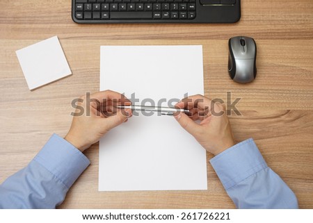 Businessman is thinking in office over empty sheet of paper, thoughtful and motivation concept