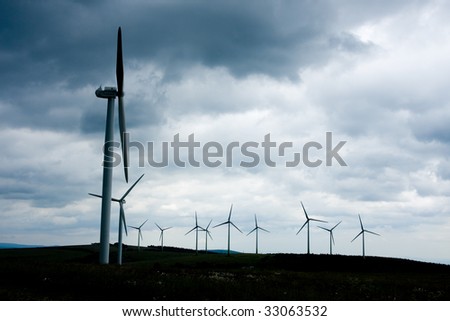 Wind power farm installation in sunny day
