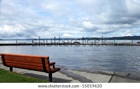 Bench facing swimming area along Lake Washington at a park in Kirkland
