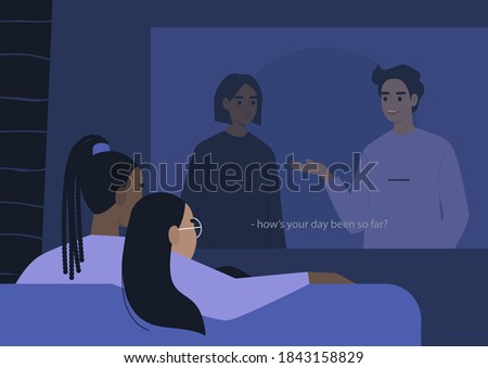 A young lesbian couple cuddling and watching a movie on a video projector, a lockdown leisure